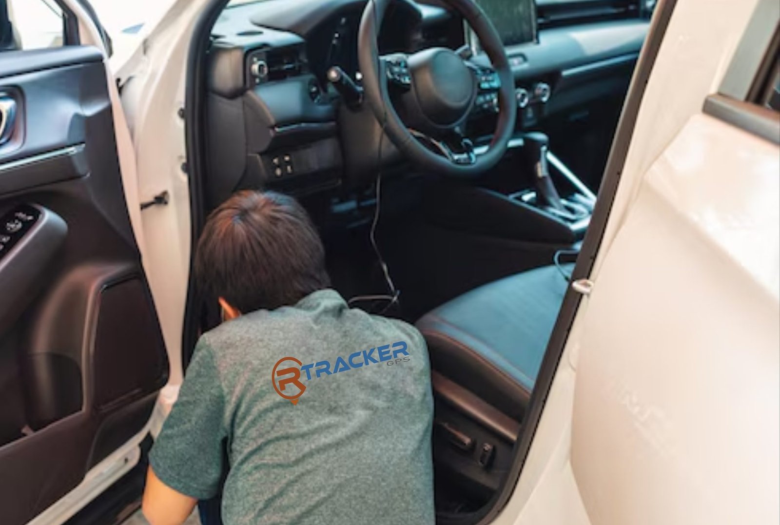 R-Tracker installer working inside a vehicle